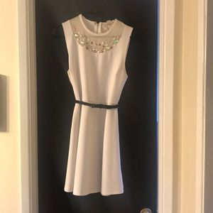 White dress with a fun beaded neckline and belt